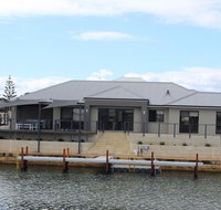 Port Bouvard Retreat - Large Family Friendly Canal Home with Private Jetty - Accommodation Rockhampton